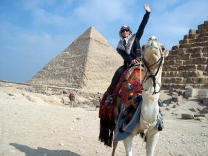 Me riding a camel in front of the Giza Pyramids in Cairo.